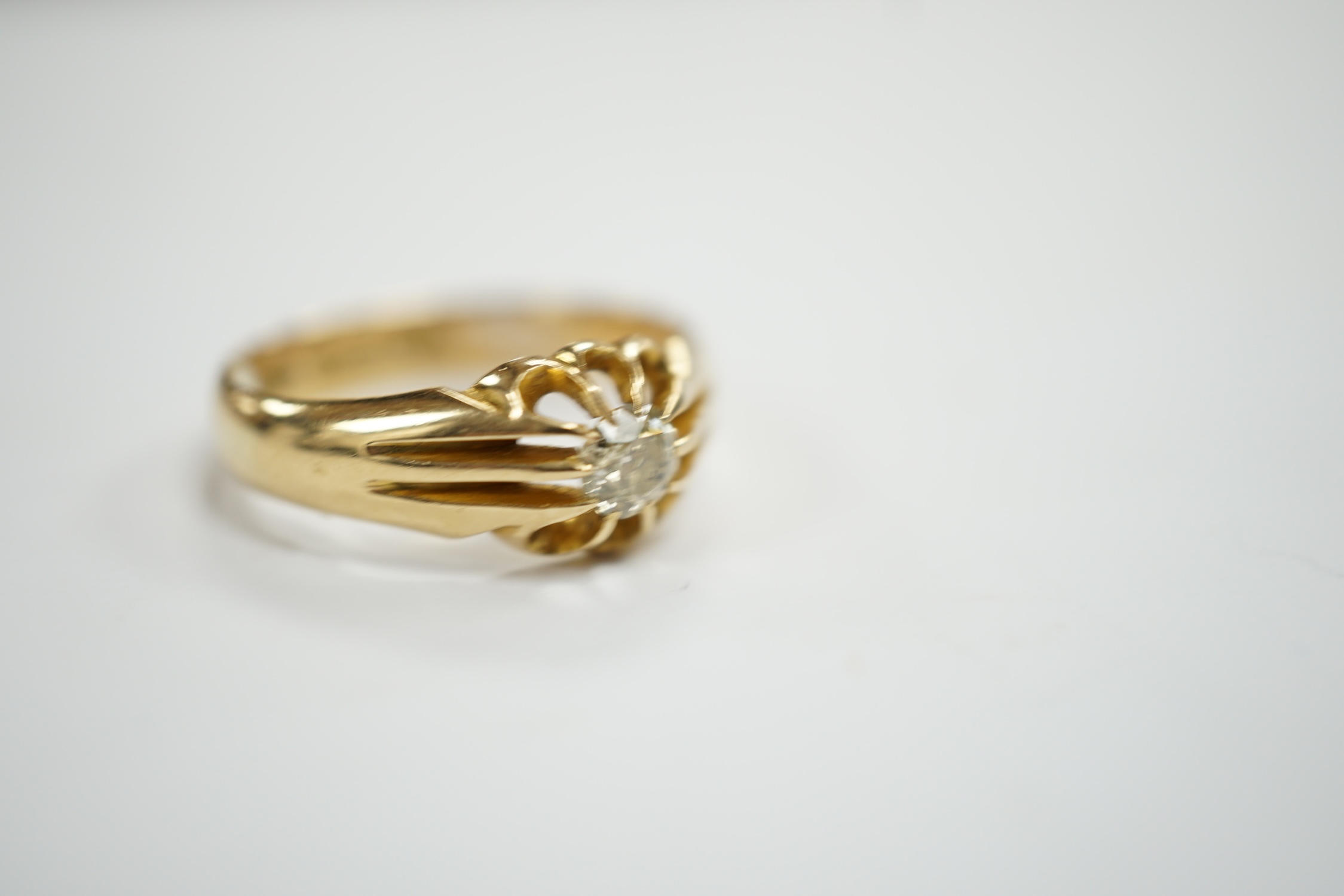 A George V 18ct gold and claw set solitaire diamond ring, size Q, gross weight 4.9 grams.